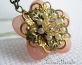 Blush pink flower pendant with gold filigree and a swarovski crystal
