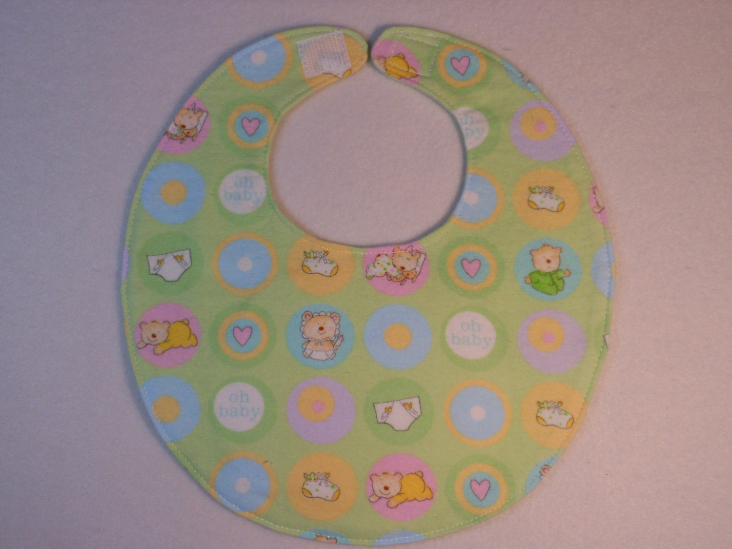Baby bib, four soft layers, reversible, green with baby bears.