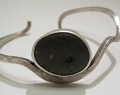 Riverstone Bracelet set in Forged silver