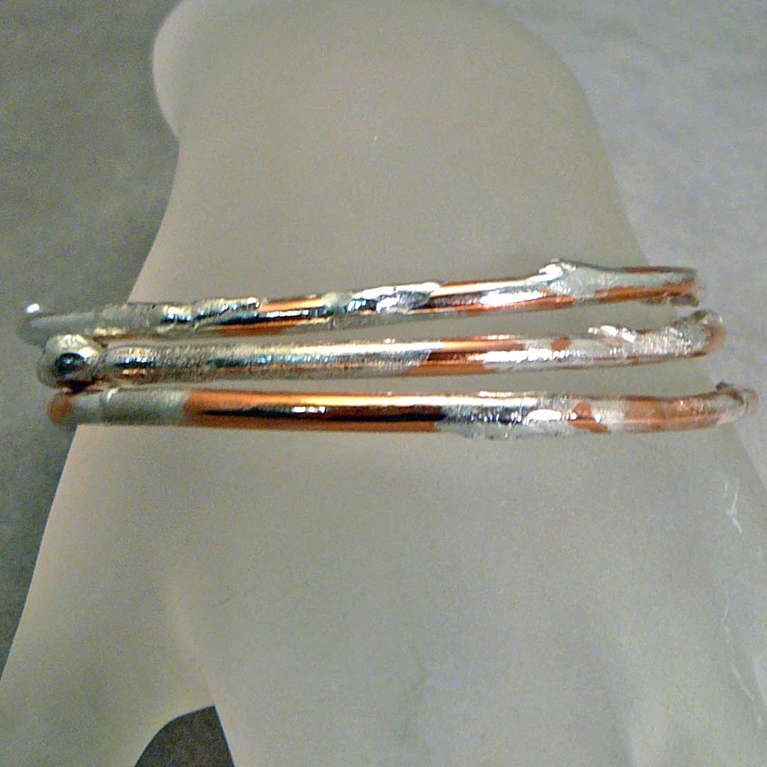Trio of copper and silver bangle bracelets