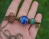 Add A Bead brass plated changeable Key Pendant with K O Lampwork European Charm Bead