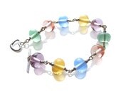 Pastel Rainbow Bracelet. Colorful ooak lampwork glass & sterling silver wire wrapped bracelet, handcrafted