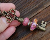 Add A Bead brass plated changeable Key Pendant with K O Lampwork European Charm Bead