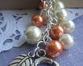 Leaf charm cluster bracelet orange ivory glass pearl. Other colours available.