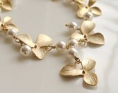 Calliope   ...matte gold flowers and Swarovski glass pearl necklace.