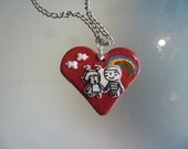polymer clay  pendant  featuring children and rainbow