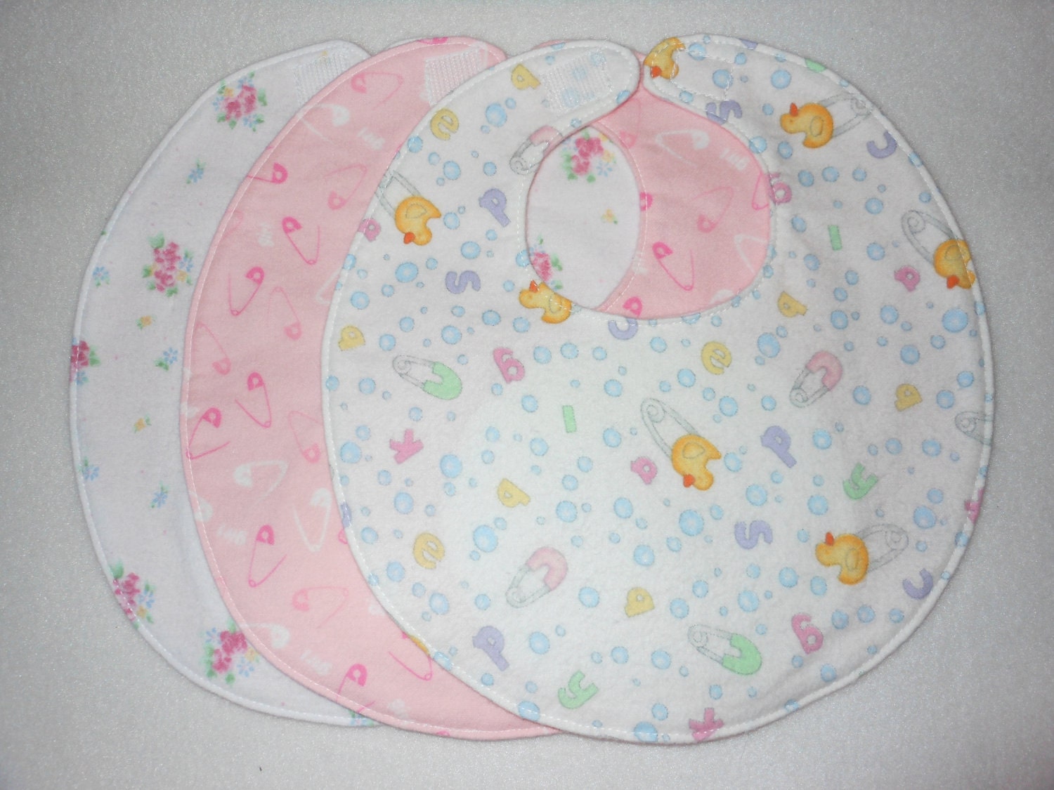 Baby bib, four soft layers, reversible, three pack, baby girl