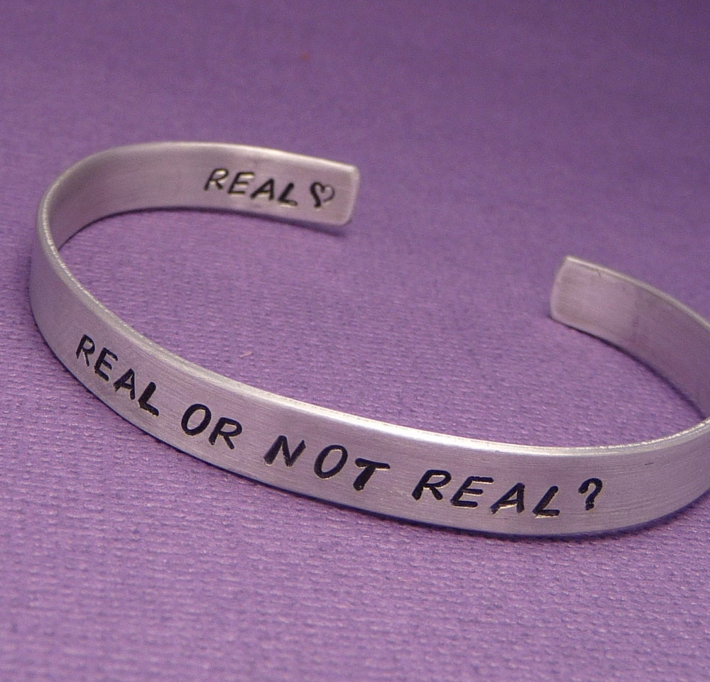 Hunger Games Inspired - Real Or Not Real Double Sided Hand Stamped Aluminum Bracelet
