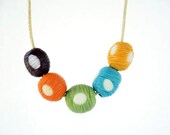 Handmade Polymer Clay Vertical Scratched White Polka Dot Beads Colorful Necklace on a Beige Leather