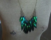 Take Flight . Genuine Egyptian Elytra Beetle wing Cascading Bib necklace.