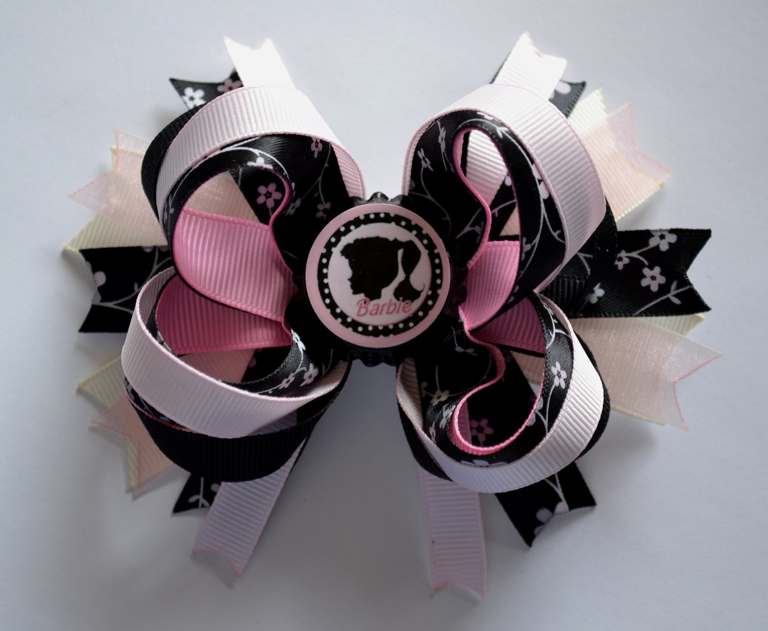 Super adorable classic Baribie bottlecap boutique bow. Pink, black, and white.