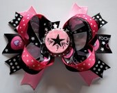 Rockstart girl's bottlecap hair bow. Pink and black