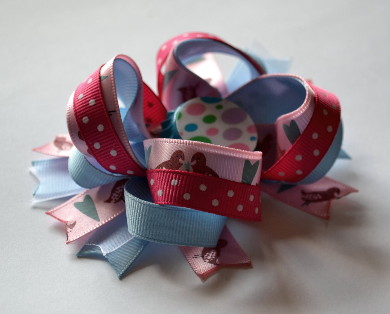 Sweet bird bottlecap hair bow. Pink and blue.