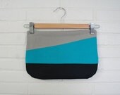 Assymetrical zipper clutch, teal.