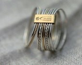 9 Candy twists silver and 18kt yellow gold stacking rings