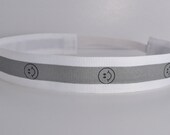 Band-It Headband .... Happy Face Reflective - White.  Will stay put and not slip.