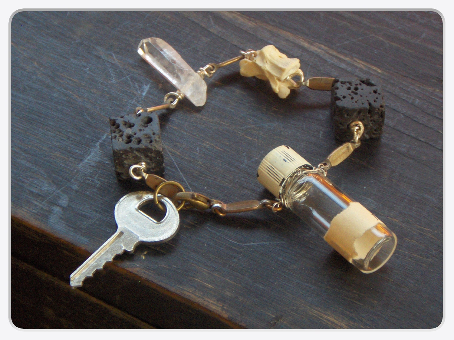 Dr. Jekyll's Laboratory . Vintage Key, Black Lava Cubes , Quartz, Mini Vial and Genuine Bobcat bone bracelet