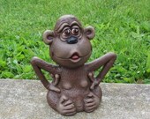 Ceramic Monkey scratching his armpits