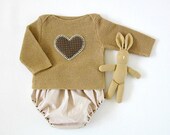 A knitted sweater with diaper cover in camel with a heart
