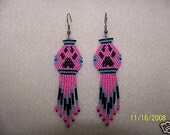 Native style beaded rose color earrings with wolf paw
