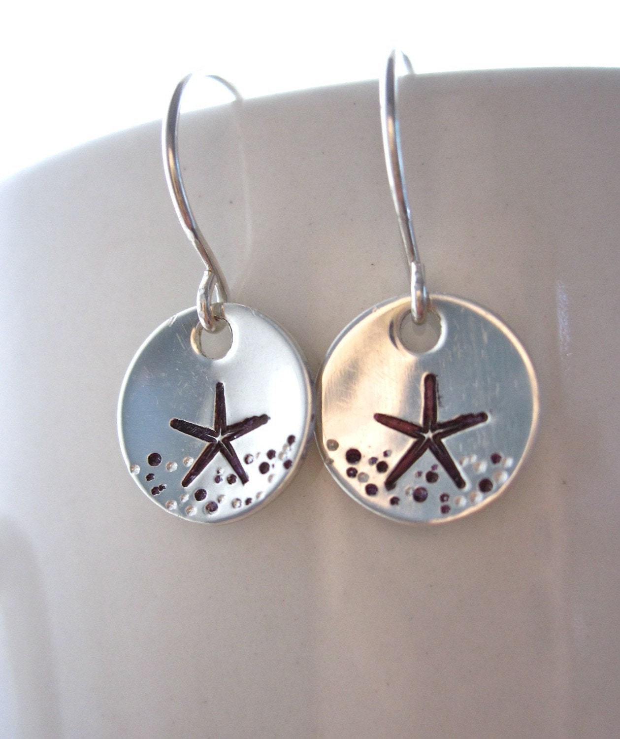 Hand stamped sterling silver starfish earrings