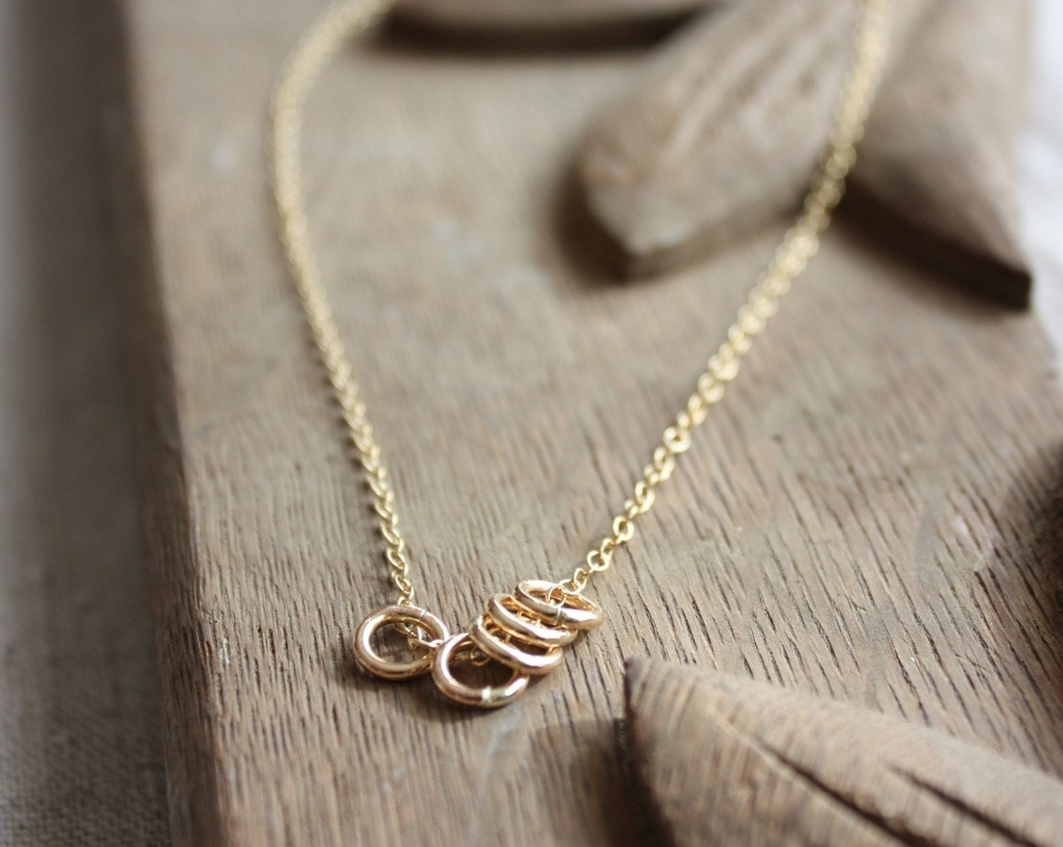 gold rings necklace- the quintet