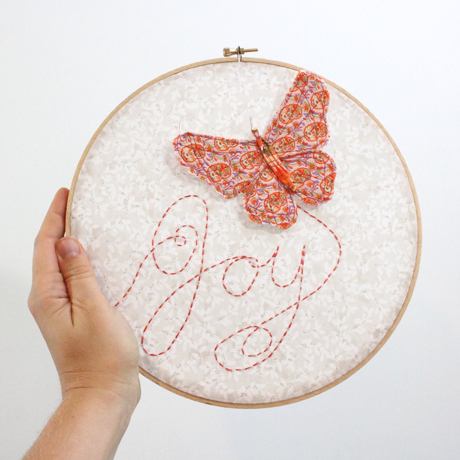 Butterfly Embroidery Hoop - Joy Flutters In - hand embroidered 10" wall hanging in peach, coral pink, beige, white, and lilac