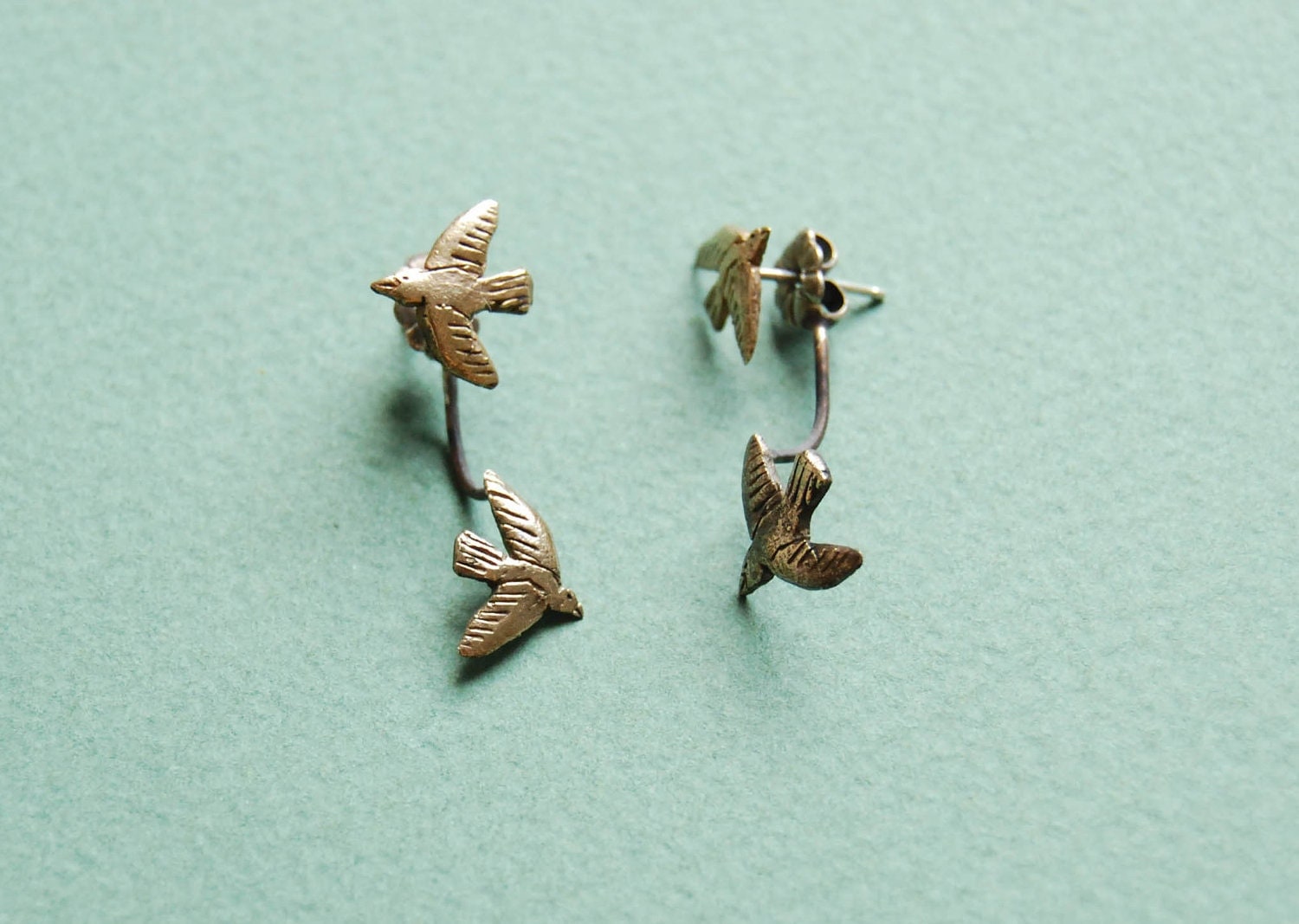 Floating golden bird stud earrings