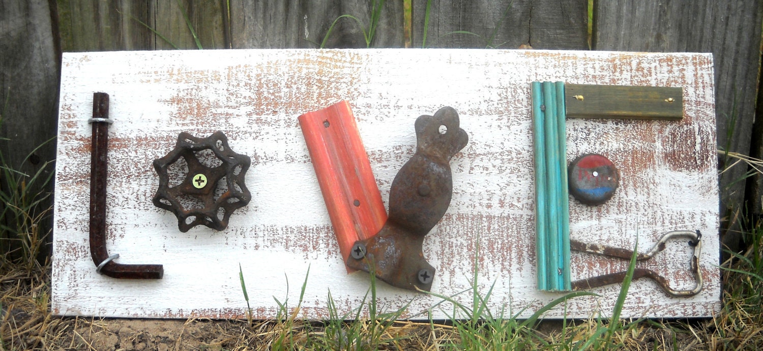 Rustic Glory Rustic "LOVE" white sign made with wood and junk from here and there.