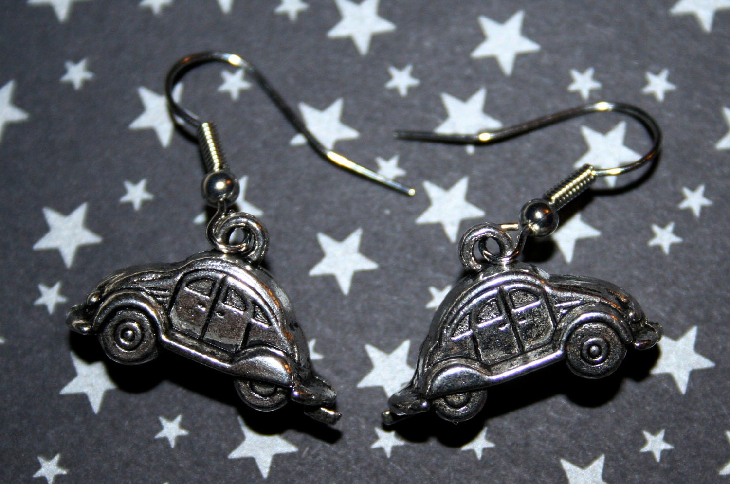 These are a pair of adorable Volkswagen beetle earrings