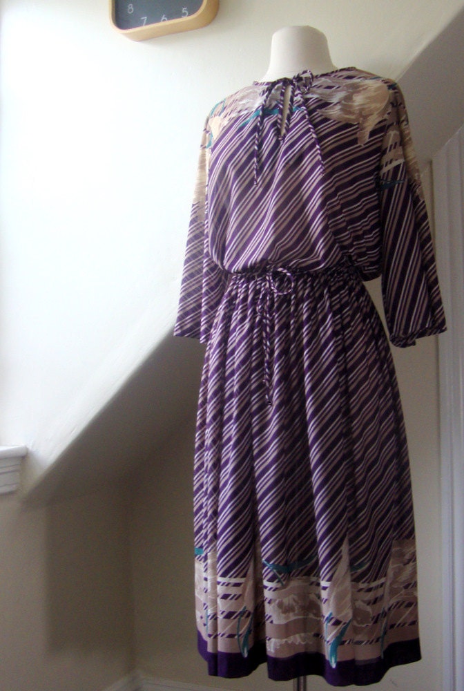 purple dress with butterfly sleeves and floral print in disco style / 1970s / m