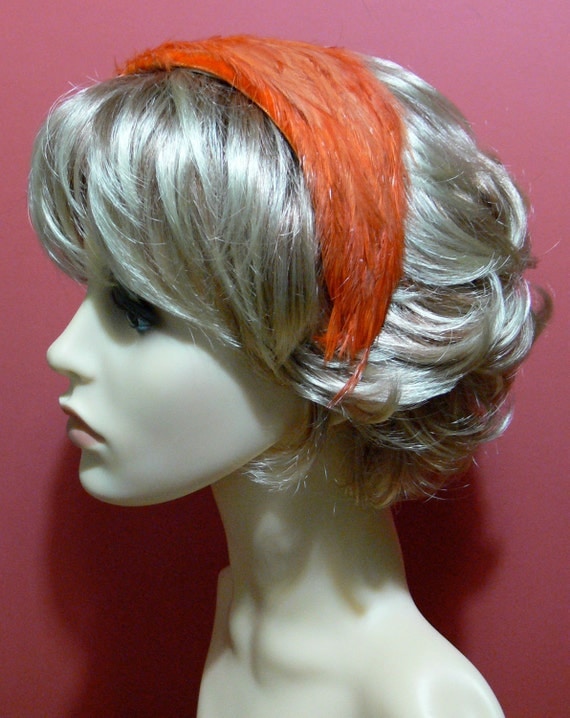 Fascinator: orange feathers