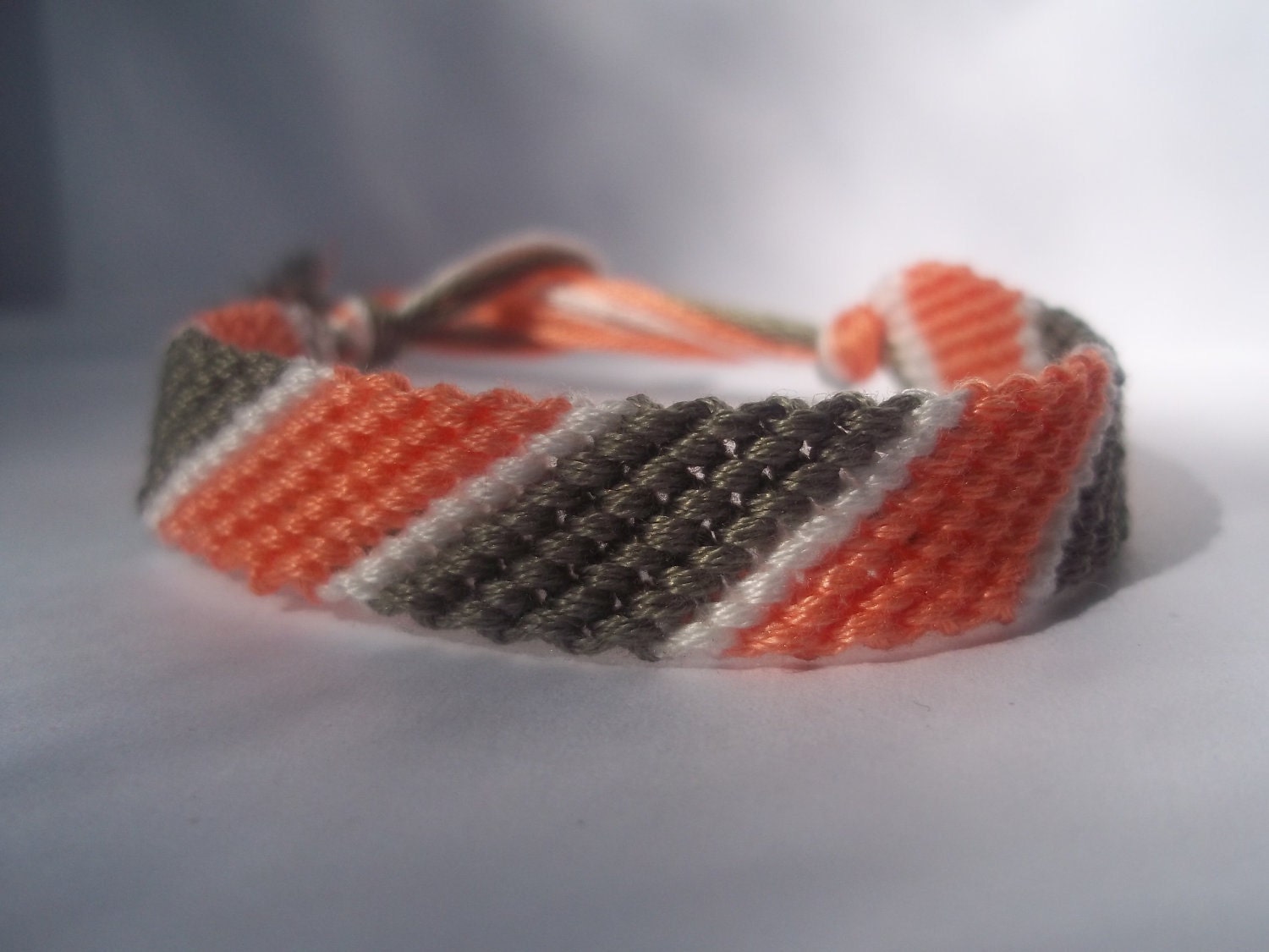 Elaine Collection: peach, white, and gray friendship bracelet