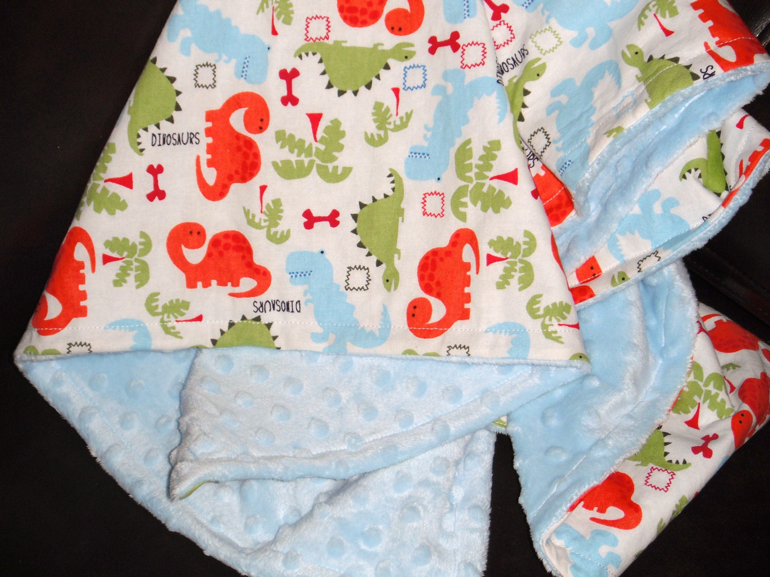 Green, Blue & Orange Dinosaurs on White with Baby Blue Minky Dot Blanket- Small 32" X 35"