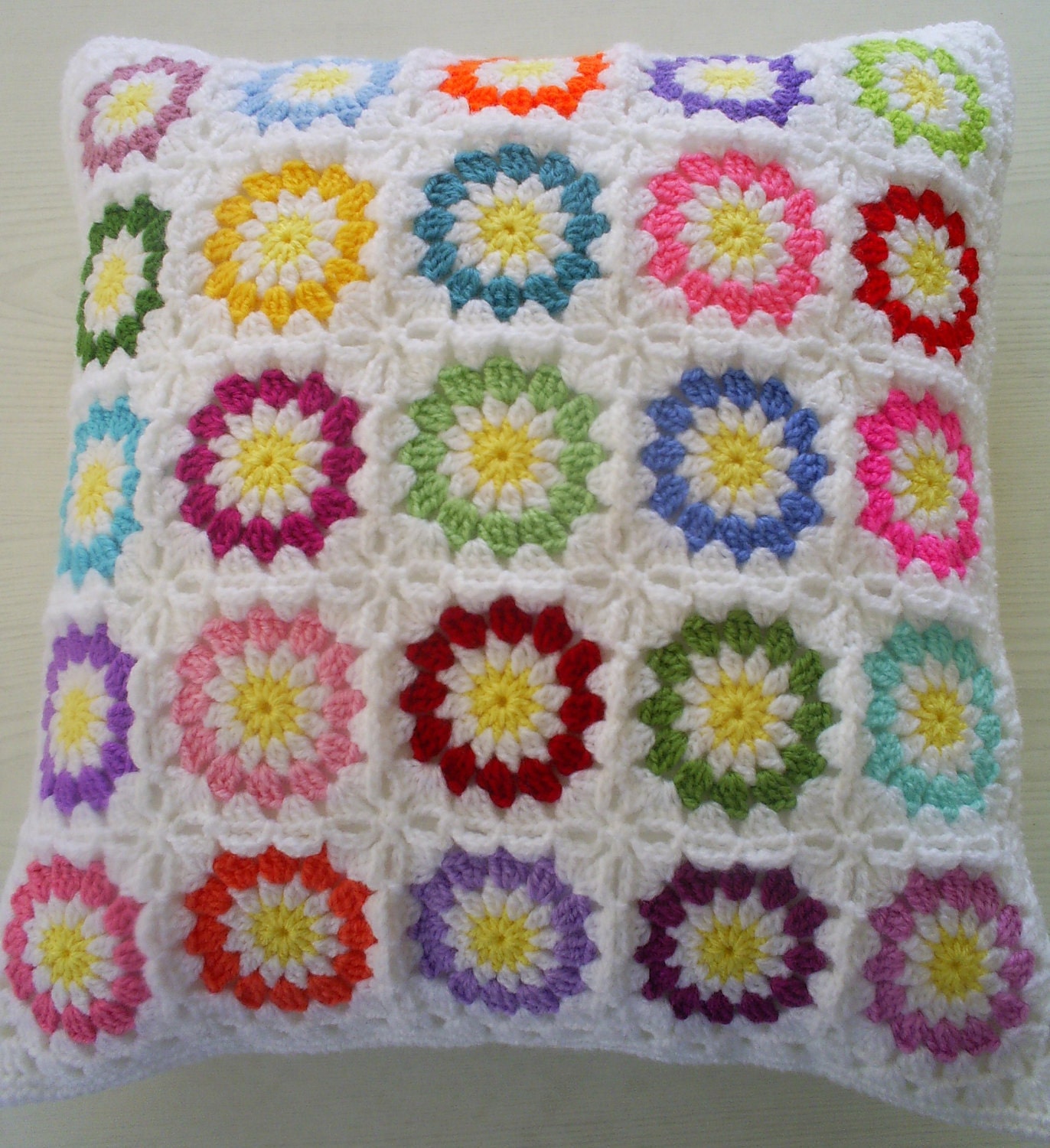 colorful circles in white granny squares cushion cover