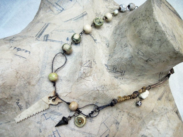 Work is Love. Ceramic rounds and bone saw rustic gypsy assemblage necklace.