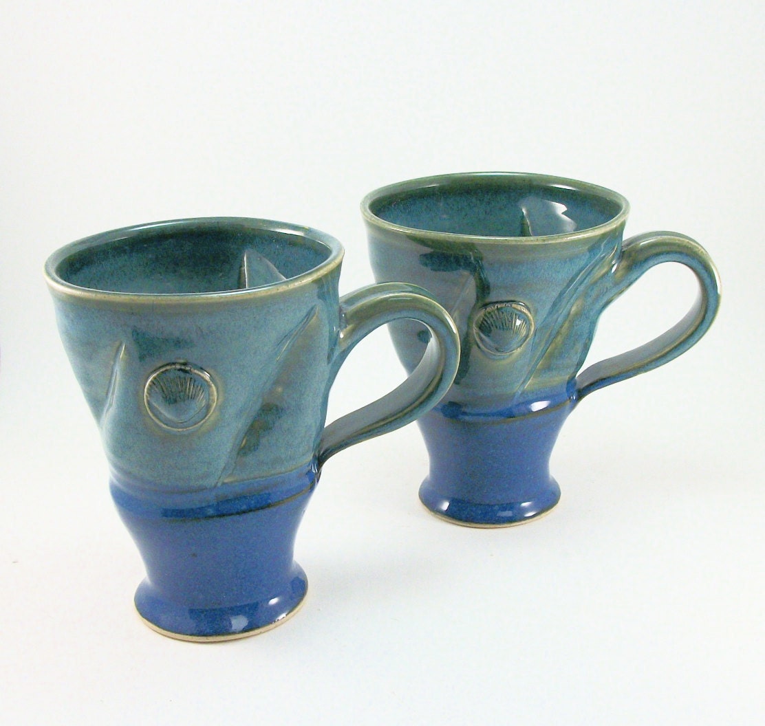 pair of fantastic blue-green mugs with shells
