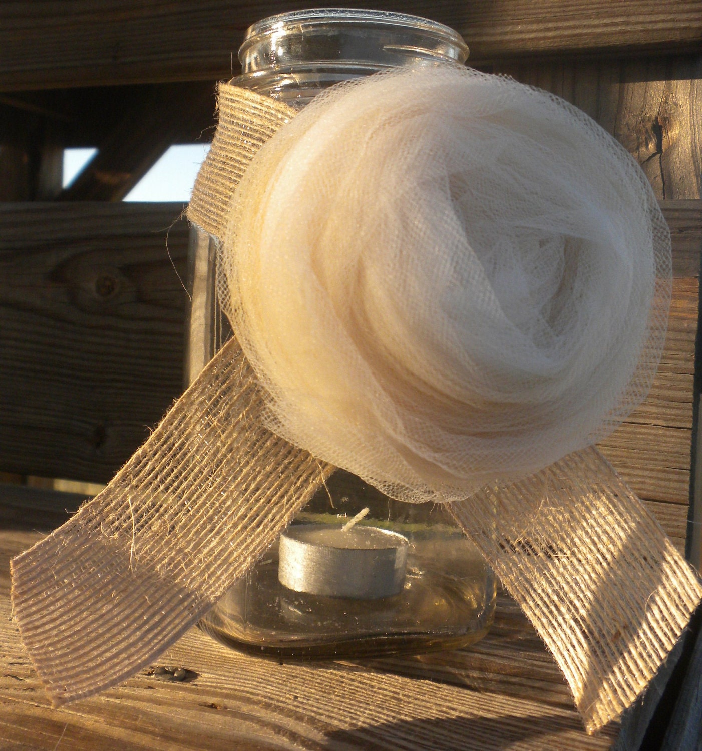 It is a tulle and burlap rosette listed as a wedding favor and I think it 