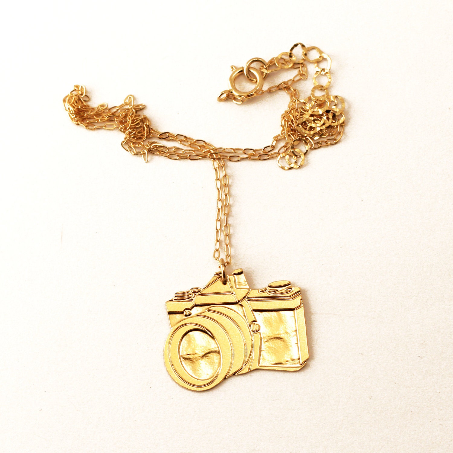 CAMERA- wild thing golden pendant