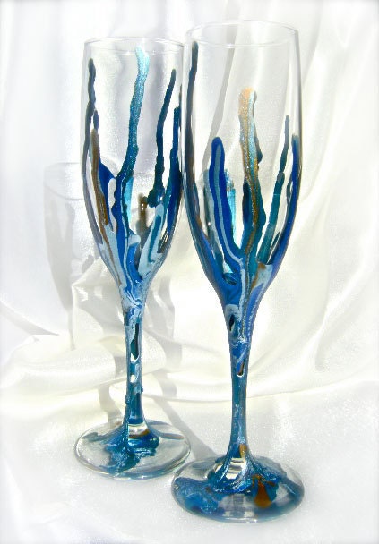 Hand decorated wedding champagne flutes in light blue royal blue gold and