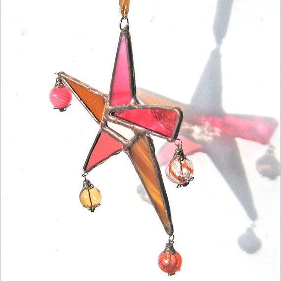 Stained Glass Carnival Star Suncatcher in pinks and cinnamon and caramel