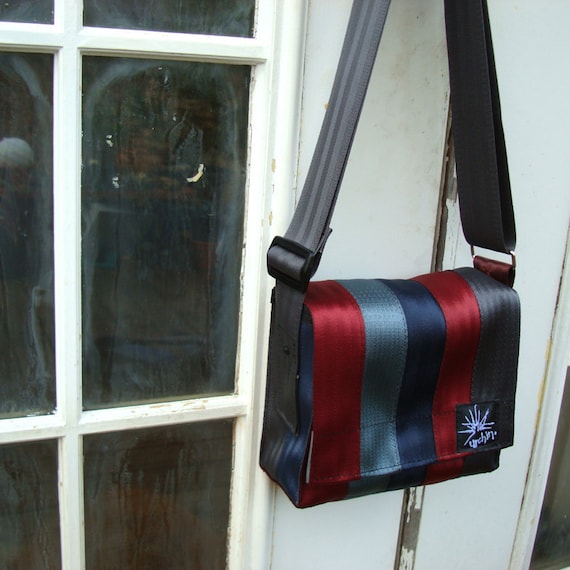 Seat belt bag made from reclaimed seatbelts.