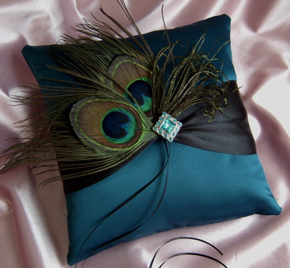 This gorgeous pillow is made of teal colored bridal satin and features two 