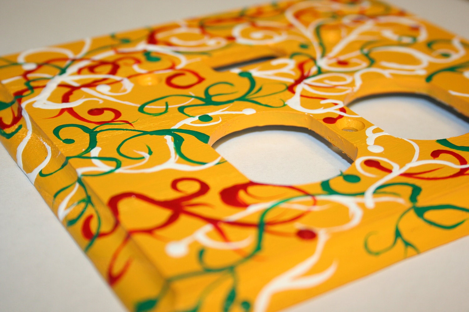 Hand Painted Toggle Duplex Outlet Cover Plate- Yellow with Red, White and Green Swirls