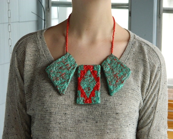 Kiki Koyotes - The Giant's Causeway bib in southwest turquoise and flame