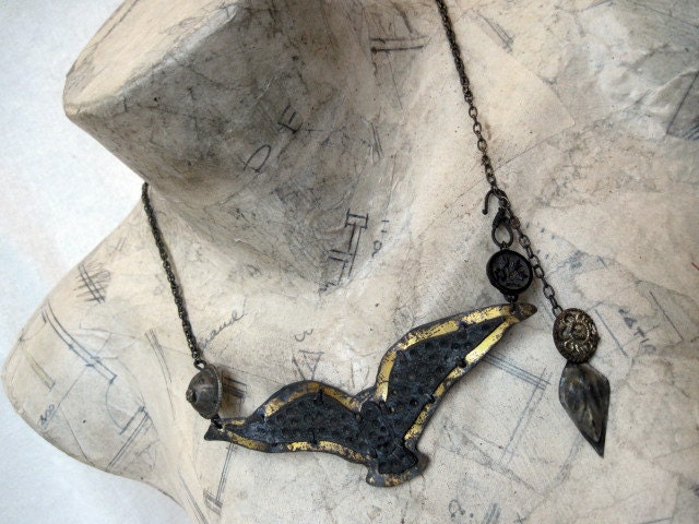 Lone and Vast. Black Oxidized Pewter Bird in Tin Bezel with Tribal Buttons.