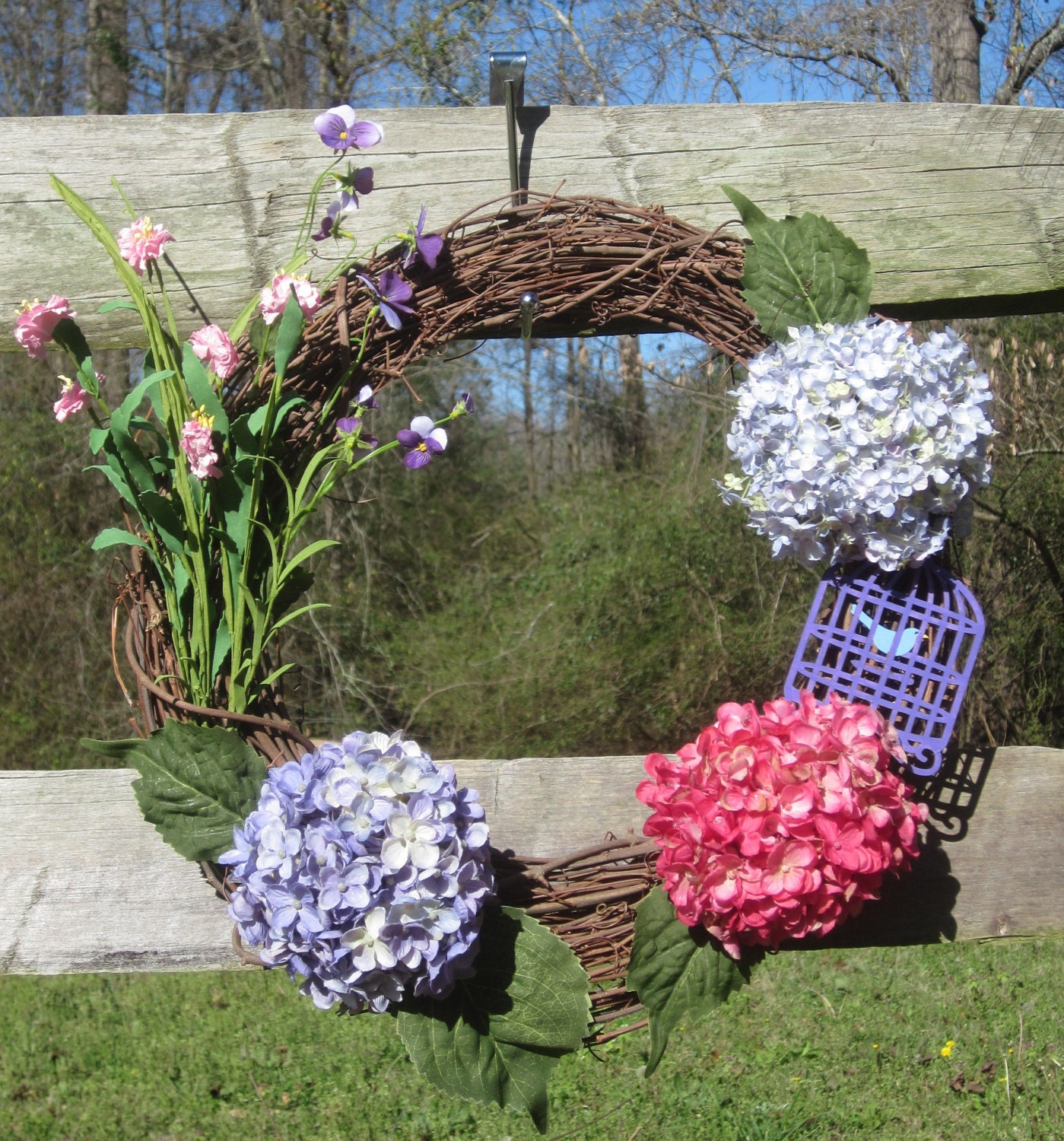 Grapevine with Hydrangeas and caged bird