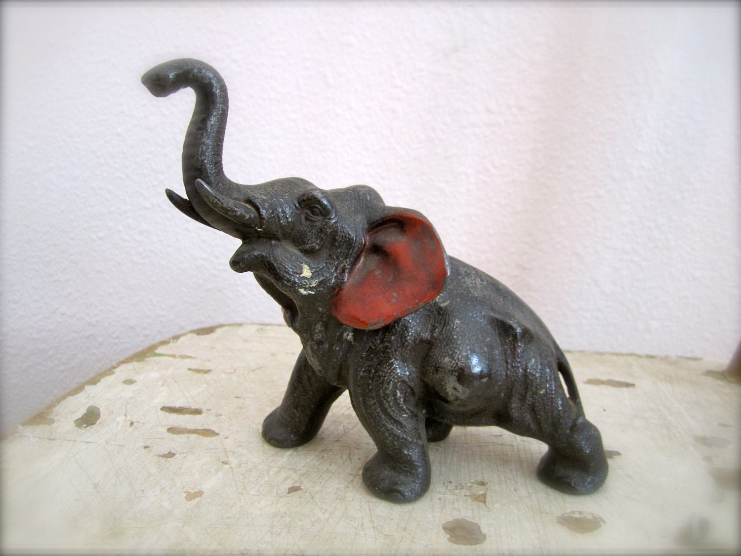 A large metal vintage elephant toy