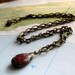 niraj wire-wrapped red pendant on bronze chain