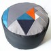 Pi geometric patchwork pouffe.